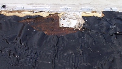 Missing EPDM Exposes Wood